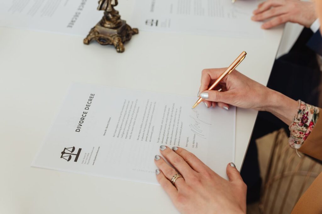 person signing on white paper 7876053 person signing on white paper 7876053